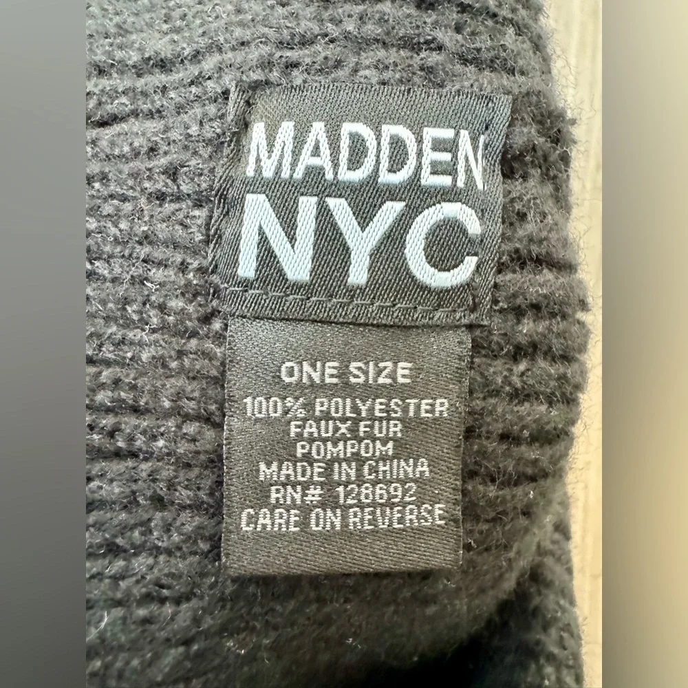 Madden NYC women’s beanie hat with decorative trim and pom-pom. Excellent condi